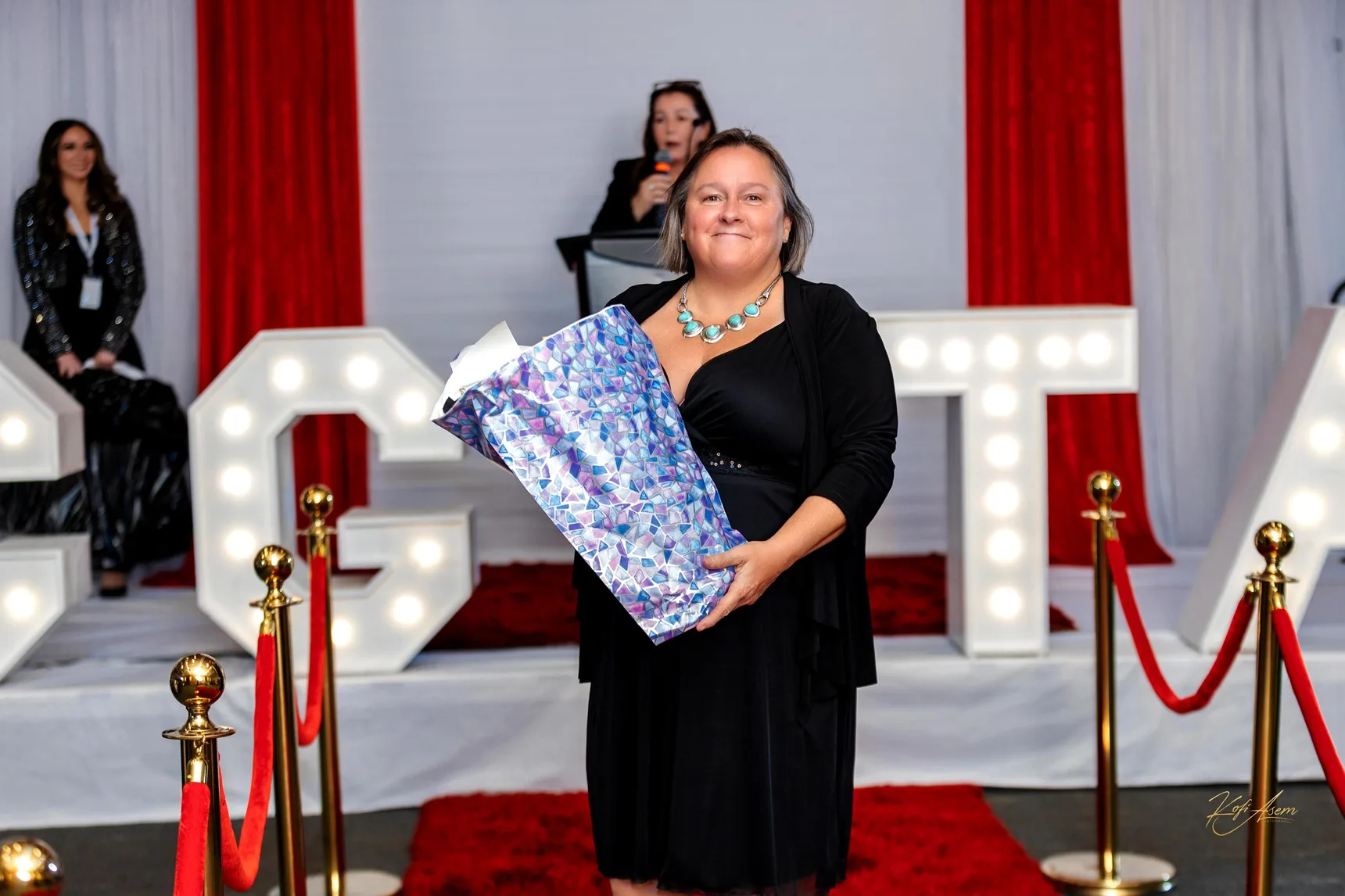 Banquet tables and gold award trophies set for the Ignite A Life Awards gala
